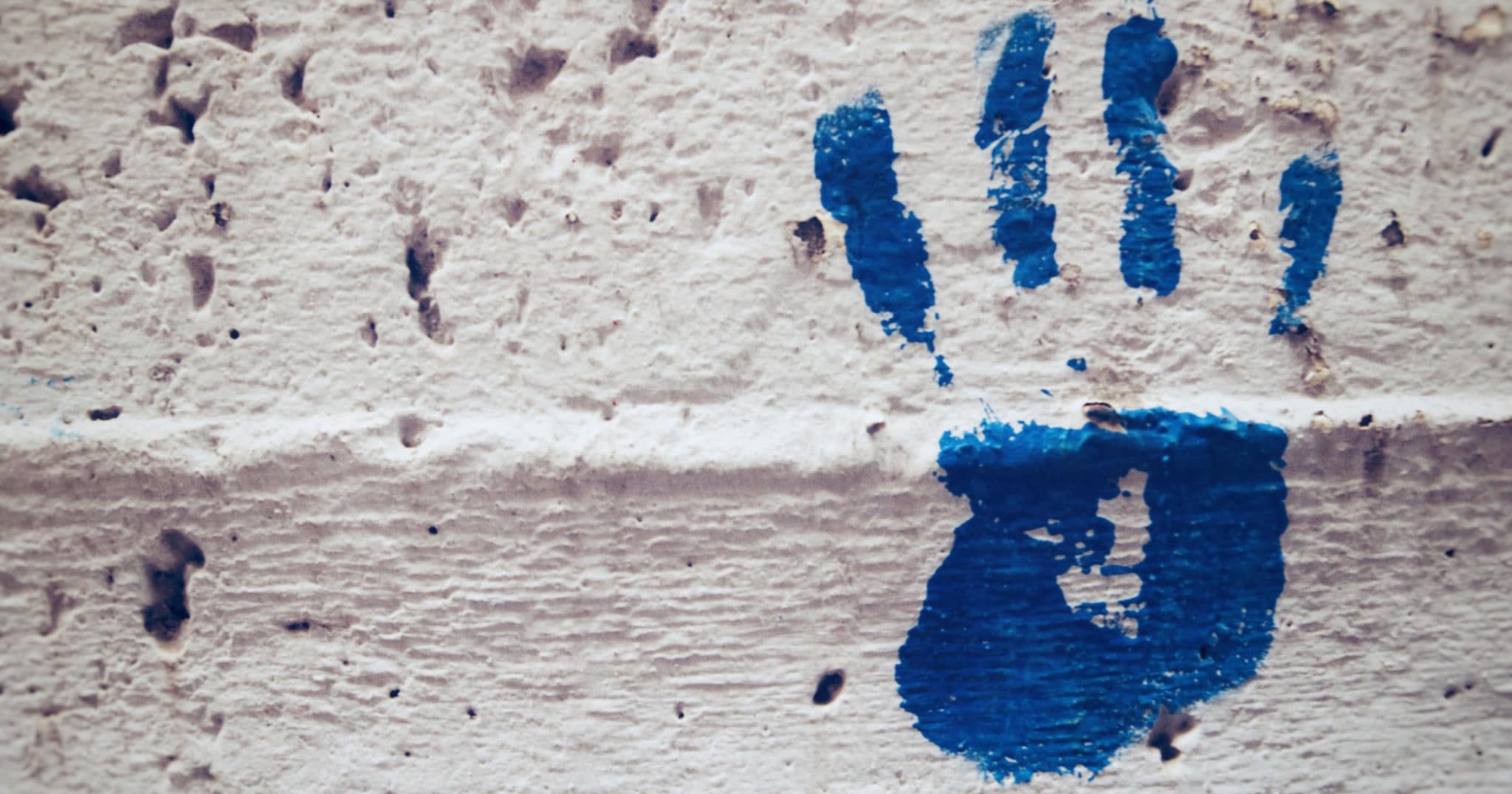 Handprint on wall graffiti